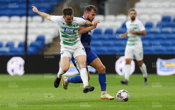 040723 - Cardiff City v The New Saints, Pre season friendly - Dan Williams of TNS and Joe Ralls of Cardiff City tangle as they compete for the ball