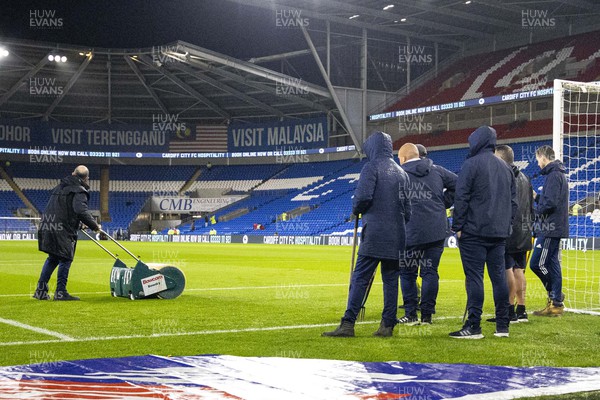 021122 - Cardiff City v Watford - Sky Bet Championship - Cardiff City Stadium ground staff inspect the pitch ahead of the match