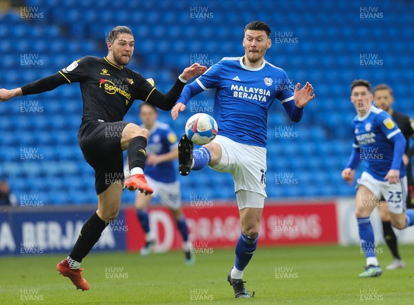 130321 Cardiff City v Watford, Sky Bet Championship - Francisco Sierralta of Watford and Kieffer Moore of Cardiff City compete for the ball