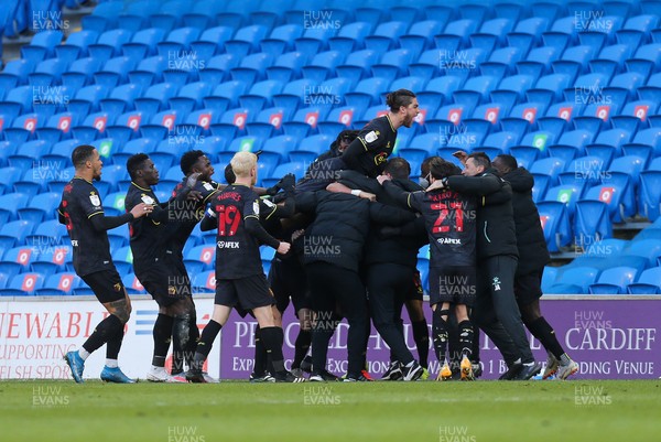 130321 Cardiff City v Watford, Sky Bet Championship - Watford players and management mob Adam Masina after he scores the winning goal in added time