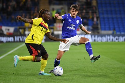 131026 - Cardiff City v Watford - Sky Bet Championship - Perry NG of Cardiff City is challenged by Jordan Zemura of Watford