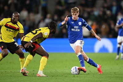 131026 - Cardiff City v Watford - Sky Bet Championship - Joel Bagan of Cardiff City is challenged by Jordan Zemura of Watford