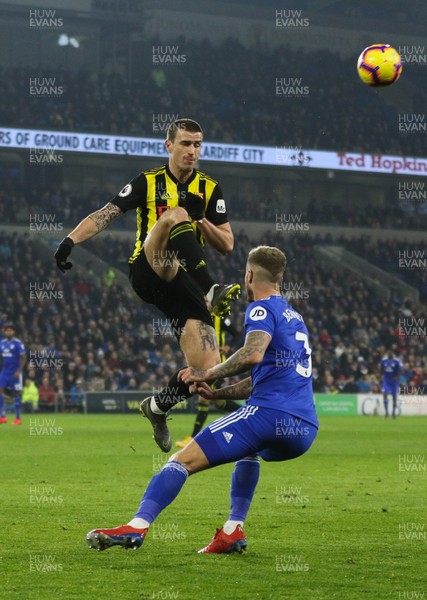 220219 - Cardiff City v Watford, Premier League - Daryl Janmaat of Watford wins the ball from Joe Bennett of Cardiff City