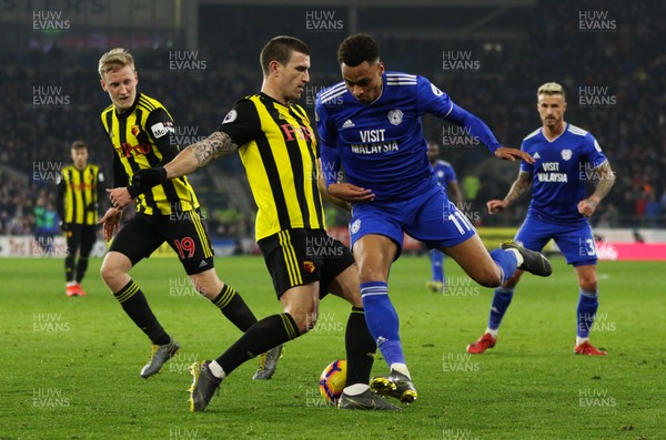 220219 - Cardiff City v Watford, Premier League - Josh Murphy of Cardiff City is tackled by Daryl Janmaat of Watford