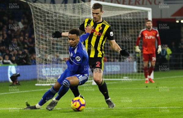 220219 - Cardiff City v Watford, Premier League - Josh Murphy of Cardiff City holds off Daryl Janmaat of Watford