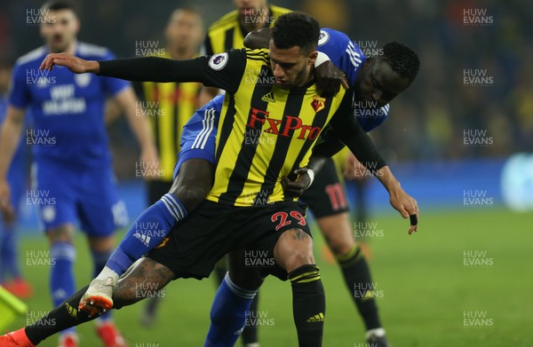 220219 - Cardiff City v Watford, Premier League - Oumar Niasse of Cardiff City and Etienne Capoue of Watford compete for the ball