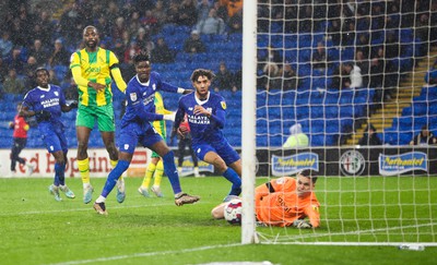 150323 - Cardiff City v West Bromwich Albion, EFL Sky Bet Championship - Sory Kaba of Cardiff City, left and Kion Etete of Cardiff City look on as Kaba’s header beats \West Bromwich Albion goalkeeper Josh Griffiths to score goal