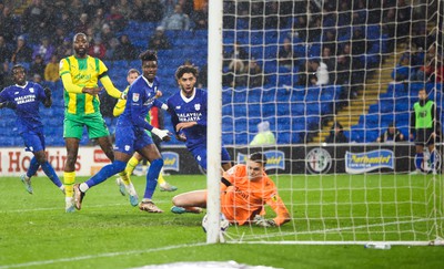 150323 - Cardiff City v West Bromwich Albion, EFL Sky Bet Championship - Sory Kaba of Cardiff City, left and Kion Etete of Cardiff City look on as Kaba’s header beats \West Bromwich Albion goalkeeper Josh Griffiths to score goal