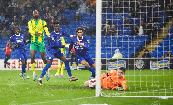 150323 - Cardiff City v West Bromwich Albion, EFL Sky Bet Championship - Sory Kaba of Cardiff City, left and Kion Etete of Cardiff City look on as Kaba’s header beats \West Bromwich Albion goalkeeper Josh Griffiths to score goal
