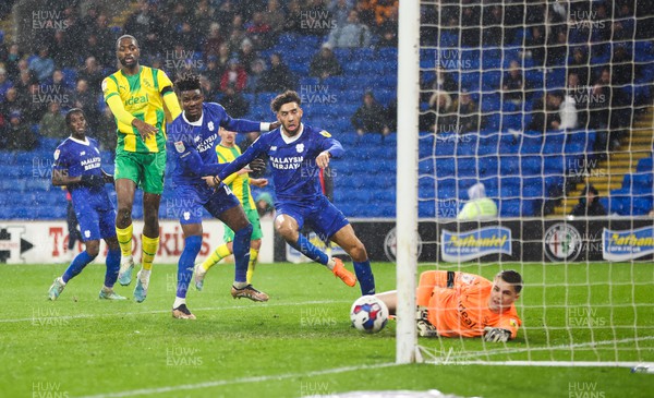 150323 - Cardiff City v West Bromwich Albion, EFL Sky Bet Championship - Sory Kaba of Cardiff City, left and Kion Etete of Cardiff City look on as Kaba’s header beats \West Bromwich Albion goalkeeper Josh Griffiths to score goal