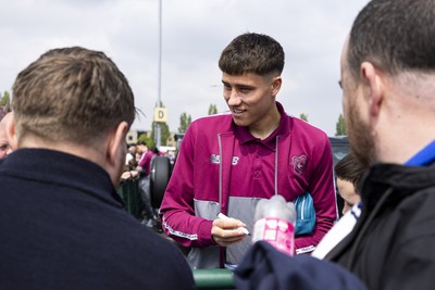 260425 - Cardiff City v West Bromwich Albion - Sky Bet Championship - Rubin Colwill of Cardiff City signs autographs ahead of the match