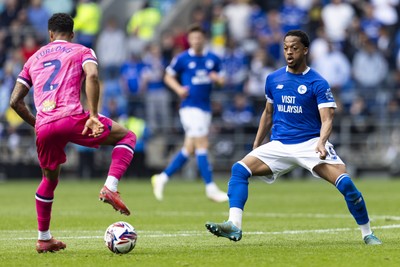 260425 - Cardiff City v West Bromwich Albion - Sky Bet Championship - Chris Willock of Cardiff City closes down Darnell Furlong of West Brom