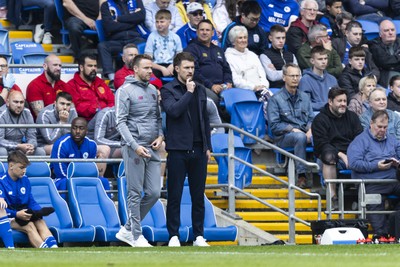 260425 - Cardiff City v West Bromwich Albion - Sky Bet Championship - Cardiff City interim manager Aaron Ramsey with Cardiff City assistant manager Chris Gunter on the touchline