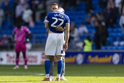 260425 - Cardiff City v West Bromwich Albion - Sky Bet Championship - Cardiff City assistant manager Chris Gunter with Yousef Salech of Cardiff City at full time