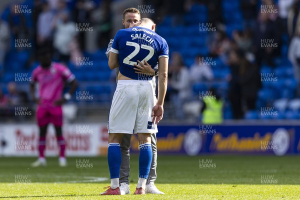 260425 - Cardiff City v West Bromwich Albion - Sky Bet Championship - Cardiff City assistant manager Chris Gunter with Yousef Salech of Cardiff City at full time