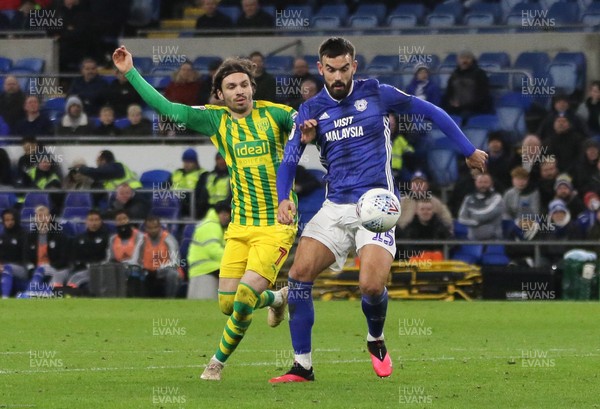 280120 - Cardiff City v West Bromwich Albion, Sky Bet Championship - Marlon Pack of Cardiff City wins the ball from Filip Krovinovic of West Bromwich Albion