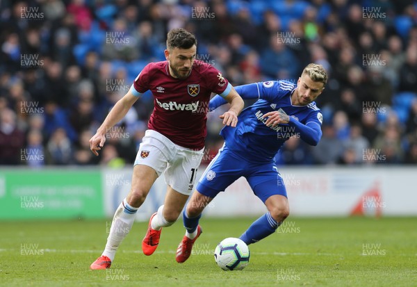 090319 - Cardiff City v West Ham United, Premier League - Robert Snodgrass of West Ham United and Joe Bennett of Cardiff City compete for the ball