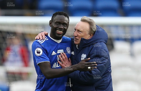 090319 - Cardiff City v West Ham United, Premier League - Cardiff City manager Neil Warnock celebrates with Oumar Niasse of Cardiff City at the end of the match