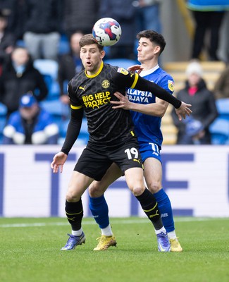 140123 - Cardiff City v Wigan Athletic, EFL Sky Bet Championship - Callum Lang of Wigan Athletic and Callum O'Dowda of Cardiff City compete for the ball