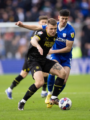 140123 - Cardiff City v Wigan Athletic, EFL Sky Bet Championship - Max Power of Wigan Athletic holds off Callum O'Dowda of Cardiff City