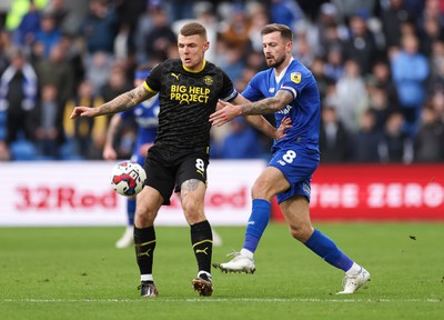 140123 - Cardiff City v Wigan Athletic, EFL Sky Bet Championship - Joe Ralls of Cardiff City and Max Power of Wigan Athletic compete for the ball