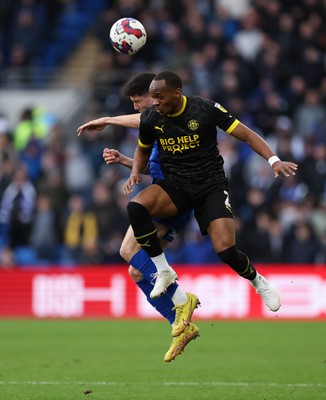 140123 - Cardiff City v Wigan Athletic, EFL Sky Bet Championship - Ryan Nyambe of Wigan Athletic beats Callum O'Dowda of Cardiff City to head the ball