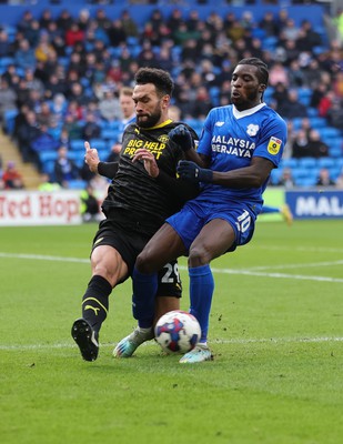 140123 - Cardiff City v Wigan Athletic, EFL Sky Bet Championship - Sheyi Ojo of Cardiff City is challenged by Steven Caulker of Wigan Athletic