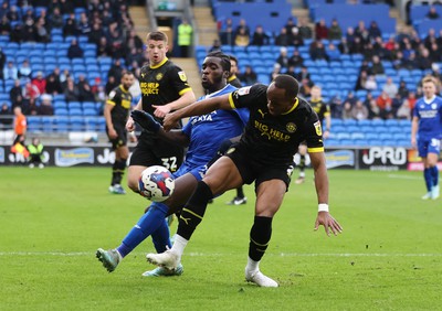 140123 - Cardiff City v Wigan Athletic, EFL Sky Bet Championship - Sheyi Ojo of Cardiff City is challenged by Ryan Nyambe of Wigan Athletic