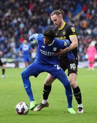 140123 - Cardiff City v Wigan Athletic, EFL Sky Bet Championship - Jaden Philogene of Cardiff City is held by Will Keane of Wigan Athletic