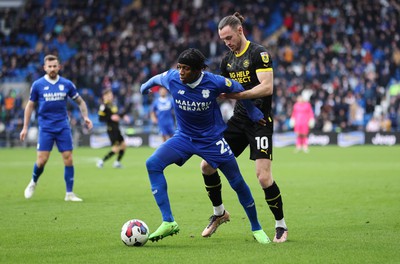 140123 - Cardiff City v Wigan Athletic, EFL Sky Bet Championship - Jaden Philogene of Cardiff City is held by Will Keane of Wigan Athletic