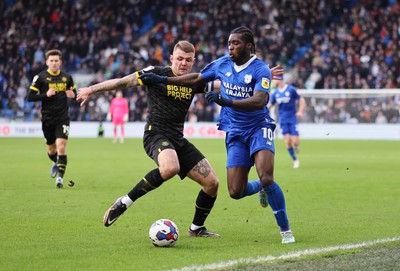 140123 - Cardiff City v Wigan Athletic, EFL Sky Bet Championship - Sheyi Ojo of Cardiff City gets past Max Power of Wigan Athletic