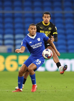 140123 - Cardiff City v Wigan Athletic, EFL Sky Bet Championship - Andy Rinomhota of Cardiff City is challenged by Miguel Azeez of Wigan Athletic