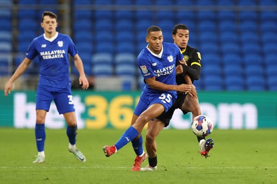 140123 - Cardiff City v Wigan Athletic, EFL Sky Bet Championship - Andy Rinomhota of Cardiff City is challenged by Miguel Azeez of Wigan Athletic