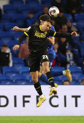 140123 - Cardiff City v Wigan Athletic, EFL Sky Bet Championship - Josh Magennis of Wigan Athletic out jumps Callum O'Dowda of Cardiff City to head the ball