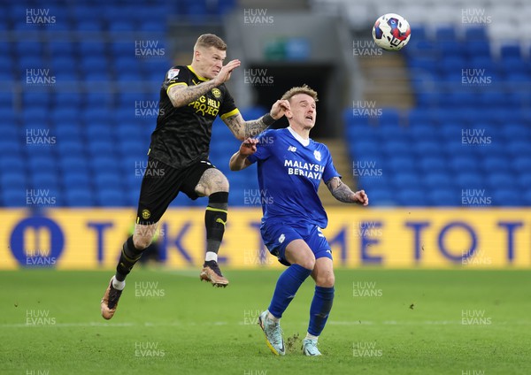 140123 - Cardiff City v Wigan Athletic, EFL Sky Bet Championship - James McClean of Wigan Athletic challenges Isaak Davies of Cardiff City for the ball