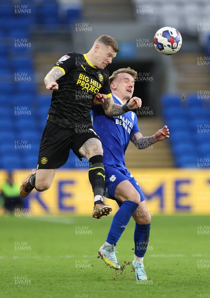 140123 - Cardiff City v Wigan Athletic, EFL Sky Bet Championship - James McClean of Wigan Athletic challenges Isaak Davies of Cardiff City for the ball