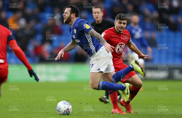 150220 - Cardiff City v Wigan Athletic - SkyBet Championship - Lee Tomlin of Cardiff City is tackled by Sam Morsy of Wigan