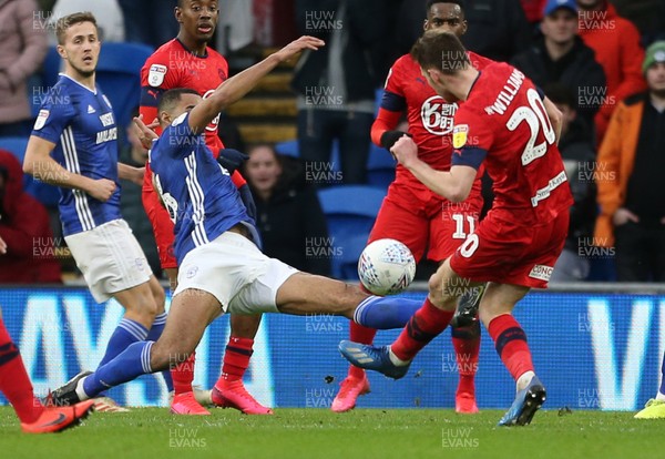 150220 - Cardiff City v Wigan Athletic - SkyBet Championship - Curtis Nelson of Cardiff City watches as the ball deflects off his arm giving Wigan the penalty to restore the lead