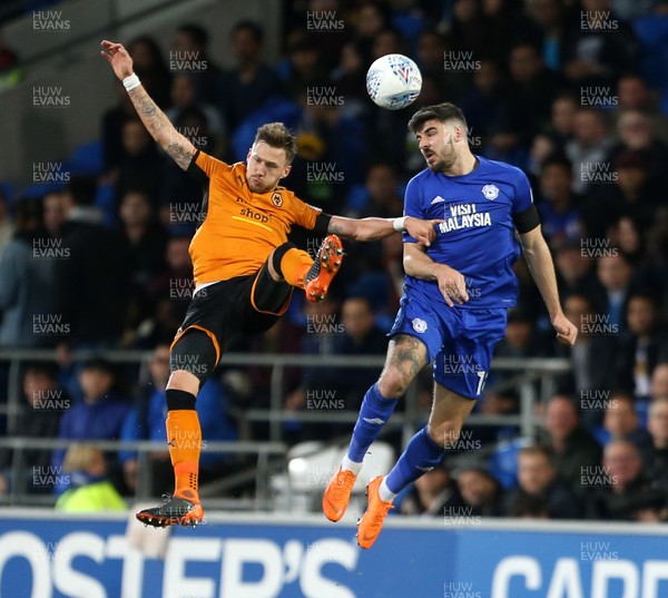 060418 - Cardiff City v Wolverhampton Wanderers - SkyBet Championship - Barry Douglas of Wolves and Callum Paterson of Cardiff City go up for the ball