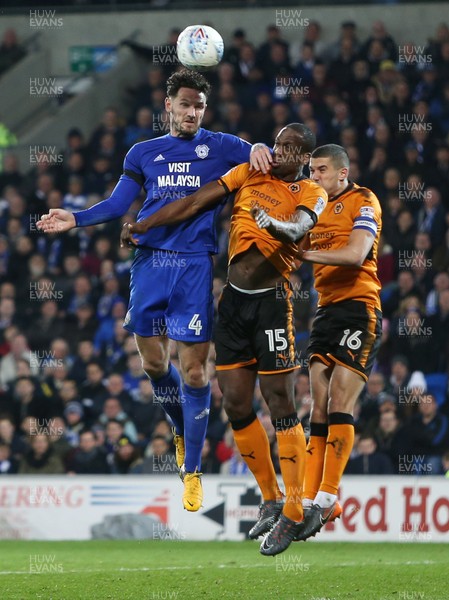 060418 - Cardiff City v Wolverhampton Wanderers - SkyBet Championship - Sean Morrison of Cardiff City is challenged by Willy Boly and Conor Coady of Wolves