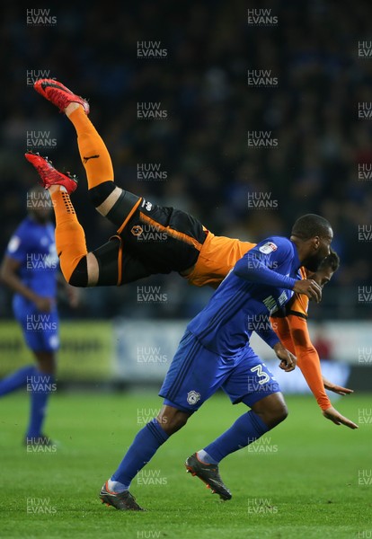 060418 - Cardiff City v Wolverhampton Wanderers, Sky Bet Championship - Matt Doherty of Wolves is upended as he competes for the ball with Junior Hoilett of Cardiff City