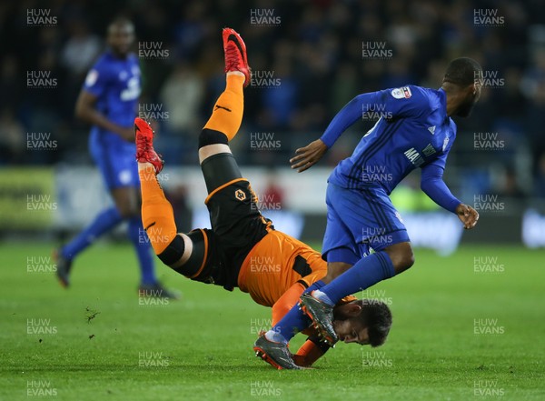 060418 - Cardiff City v Wolverhampton Wanderers, Sky Bet Championship - Matt Doherty of Wolves is upended as he competes for the ball with Junior Hoilett of Cardiff City
