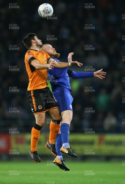 060418 - Cardiff City v Wolverhampton Wanderers, Sky Bet Championship - Aron Gunnarsson of Cardiff City and Ruben Neves of Wolves compete for the ball