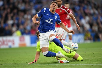 170826 - Cardiff City v Wrexham - Sky Bet Championship - Yousef Salech of Cardiff City is tackled by Anthony Patterson of Wrexham