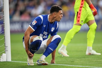 170826 - Cardiff City v Wrexham - Sky Bet Championship - Yousef Salech of Cardiff City is tackled by Anthony Patterson of Wrexham