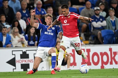 170826 - Cardiff City v Wrexham - Sky Bet Championship - Joel Bagan of Cardiff City is challenged by Danny Imray of Wrexham