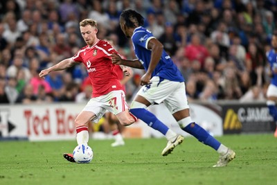 170826 - Cardiff City v Wrexham - Sky Bet Championship - Lewis O'Brien of Wrexham is challenged by Gabriel Osho of Cardiff City