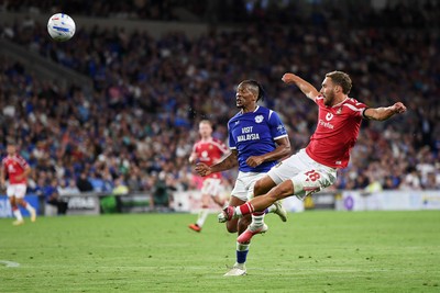 170826 - Cardiff City v Wrexham - Sky Bet Championship - Ben Sheaf of Wrexham is challenged by Gabriel Osho of Cardiff City