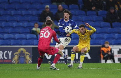 170326 - Cardiff `City v Wycombe Wanderers, EFL Sky Bet League 1 - Daniel Harvie of Wycombe Wanderers and Ollie Tanner of Cardiff City compete for the ball as Wycombe Wanderers goalkeeper Will Norris closes in