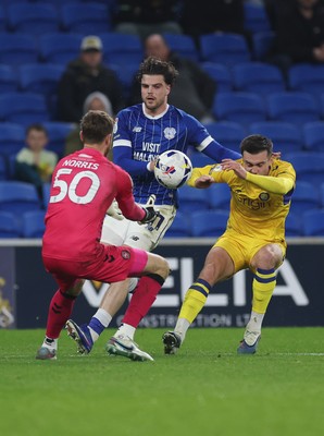 170326 - Cardiff `City v Wycombe Wanderers, EFL Sky Bet League 1 - Daniel Harvie of Wycombe Wanderers and Ollie Tanner of Cardiff City compete for the ball as Wycombe Wanderers goalkeeper Will Norris closes in